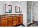 Double vanity bathroom with granite countertop and shower at 6817 S Webster St # C, Littleton, CO 80128