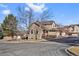 Tan two-story townhome with attached garage at 6817 S Webster St # C, Littleton, CO 80128