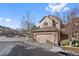 Townhome exterior showcasing garage and landscaping at 6817 S Webster St # C, Littleton, CO 80128