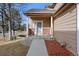 Front entrance with brick detailing and a walkway at 6817 S Webster St # C, Littleton, CO 80128