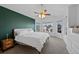 Main bedroom with green accent wall and ample natural light at 6817 S Webster St # C, Littleton, CO 80128