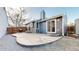Backyard featuring a patio, gray siding, chimney, and well-maintained landscaping at 3071 S Truckee St, Aurora, CO 80013