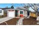 Charming single-Gathering home features a brick and gray exterior with a well-manicured front yard at 3071 S Truckee St, Aurora, CO 80013