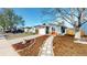 Street view of a cozy home with a well-maintained lawn, stone pathway and attached garage at 3071 S Truckee St, Aurora, CO 80013