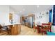 Modern kitchen with stainless steel appliances, wooden cabinets and a breakfast bar overlooking the dining area at 3071 S Truckee St, Aurora, CO 80013