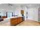 Bright kitchen with a breakfast bar, stainless steel appliances and convenient access to laundry facilities at 3071 S Truckee St, Aurora, CO 80013