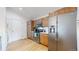 Efficient kitchen layout with stainless steel appliances, wooden cabinets and ample storage space at 3071 S Truckee St, Aurora, CO 80013