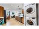 Functional kitchen design with stainless steel appliances, a breakfast bar and convenient laundry area at 3071 S Truckee St, Aurora, CO 80013