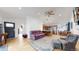 Spacious living room boasts hardwood floors and an open floor plan to the kitchen and dining area at 3071 S Truckee St, Aurora, CO 80013