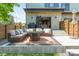 Inviting back patio with comfortable seating and a fire pit, perfect for outdoor entertaining at 2702 Lowell Blvd, Denver, CO 80211