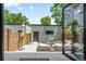 Private backyard featuring a patio with comfortable seating and a view of the surrounding landscape at 2702 Lowell Blvd, Denver, CO 80211