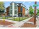Striking modern home with a unique architectural design and a well-maintained front yard at 2702 Lowell Blvd, Denver, CO 80211