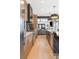 Modern kitchen with sleek appliances, stylish cabinets, and an island for gathering and dining at 2702 Lowell Blvd, Denver, CO 80211