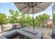 Outdoor patio featuring comfortable seating, a fire pit, and a scenic view at 2702 Lowell Blvd, Denver, CO 80211