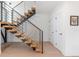 Modern staircase with sleek metal railings and natural wood steps at 2702 Lowell Blvd, Denver, CO 80211