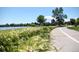 Picturesque walking path along the water's edge, offering a serene escape amidst nature at 2702 Lowell Blvd, Denver, CO 80211