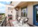 Relaxing balcony with comfortable chairs and a view of the community at 8953 E Northfield Blvd, Denver, CO 80238