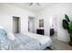 Airy bedroom with neutral walls, an ensuite bathroom, and a spacious closet at 8953 E Northfield Blvd, Denver, CO 80238