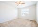 Empty bedroom bathed in natural light with neutral walls and carpeting, ready to be personalized at 8953 E Northfield Blvd, Denver, CO 80238