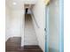 Open entryway with a view of the staircase and a blue glass front door adorned with a wreath at 8953 E Northfield Blvd, Denver, CO 80238