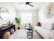 Bright living room featuring neutral decor, modern furnishings, and ample seating at 8953 E Northfield Blvd, Denver, CO 80238
