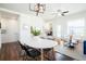 Cozy living area featuring an open concept layout, connecting to a dining and living space with warm wood accents at 8953 E Northfield Blvd, Denver, CO 80238