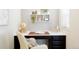 A cozy home office with a built-in desk, comfortable chair, and natural light at 8953 E Northfield Blvd, Denver, CO 80238