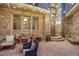 Inviting brick patio with stylish seating, string lights, and attractive brickwork at 2421 Ranch Reserve Rdg, Denver, CO 80234
