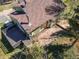 Aerial view of home showcasing roof, deck, and landscaping, highlighting the property's outdoor living spaces at 32252 Steven Way, Conifer, CO 80433