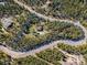 Aerial view of property, showing boundaries, cabin and surrounding trees at 32252 Steven Way, Conifer, CO 80433