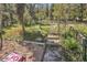 Scenic backyard featuring natural landscaping and a wooden staircase leading to elevated areas at 32252 Steven Way, Conifer, CO 80433