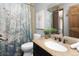 Bathroom featuring granite countertops, and a shower and tub combination with a floral curtain at 32252 Steven Way, Conifer, CO 80433
