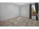 Neutral bedroom with plush carpeting, natural light, and simple finishes at 32252 Steven Way, Conifer, CO 80433