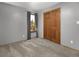 Serene bedroom with neutral carpet, ample natural light, and a closet at 32252 Steven Way, Conifer, CO 80433
