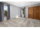 Cozy bedroom featuring plush carpeting and abundant natural light at 32252 Steven Way, Conifer, CO 80433