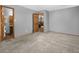 Spacious bedroom with neutral carpet, grey walls and access to a bathroom at 32252 Steven Way, Conifer, CO 80433