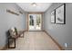 Inviting entryway with tile floors, bench seating, and outdoor views through the glass paneled doors at 32252 Steven Way, Conifer, CO 80433
