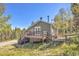 Charming home featuring a deck and lush surroundings at 32252 Steven Way, Conifer, CO 80433