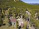 Secluded cabin retreat with surrounding forest and private driveway at 32252 Steven Way, Conifer, CO 80433