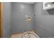 Functional laundry room with tile flooring, gray paint, and a utility sink hookup at 32252 Steven Way, Conifer, CO 80433