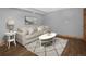 Bright living room with comfortable seating, stylish decor, and wood-look floors at 32252 Steven Way, Conifer, CO 80433