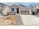 Charming single-Gathering home with a two-car garage and modern stone accents at 9712 Cathay St, Commerce City, CO 80022