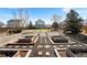 Large backyard with a brick-lined garden and established wooden garden boxes at 2331 Ance St, Strasburg, CO 80136