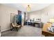 Inviting bedroom with a garment rack, crafting area, and abundant natural light, ideal for hobbies and relaxation at 2331 Ance St, Strasburg, CO 80136
