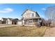 Inviting two-story home with a covered porch, set on a landscaped lot with mature trees at 2331 Ance St, Strasburg, CO 80136