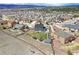 A stunning aerial view of a home with a spacious yard and playground in a Gathering-friendly neighborhood at 795 Woodmoor Acres Dr, Monument, CO 80132
