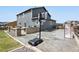 Backyard shot featuring a built in BBQ, basketball court, hockey net, and fenced yard at 795 Woodmoor Acres Dr, Monument, CO 80132