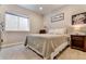 Cozy bedroom with natural light, carpeted floor, and contemporary decor at 795 Woodmoor Acres Dr, Monument, CO 80132