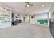 Large bonus room featuring carpet floors, storage shelves, and natural light at 795 Woodmoor Acres Dr, Monument, CO 80132