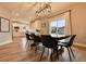 Beautiful dining area with wood floors and a large window provides ample space and great natural light at 795 Woodmoor Acres Dr, Monument, CO 80132